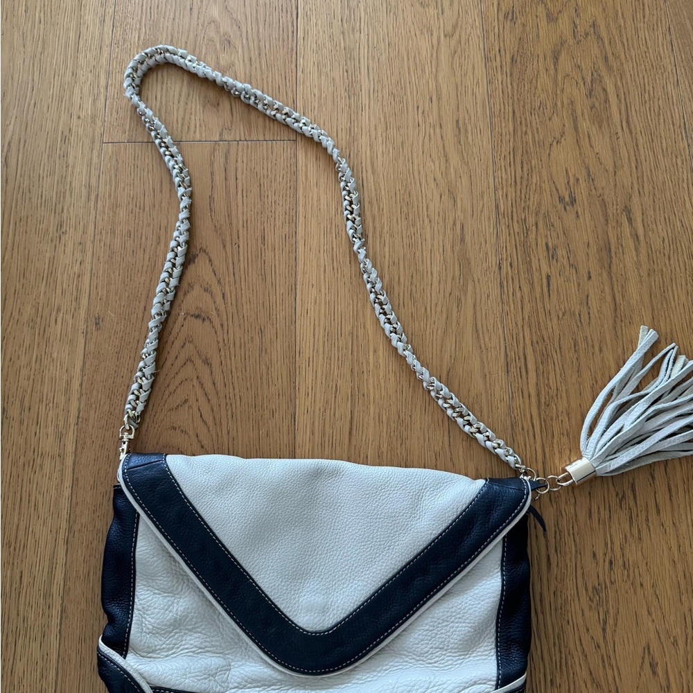 Tina Turk Stylish Black and White Women's Bag with tassel charm on the side